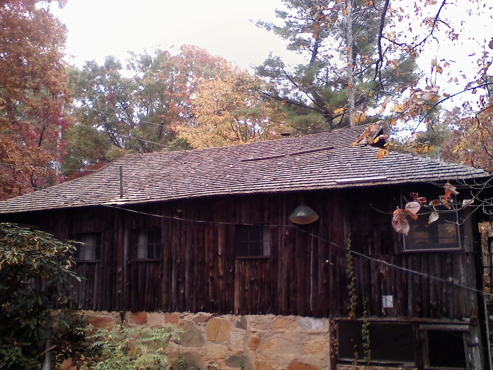 Weathered wood shake roof on a rustic board sided cabin in Tieton